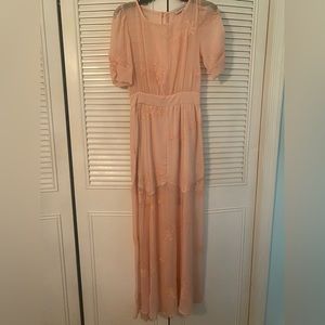 Long pink lace dress. Lined at the bottom.